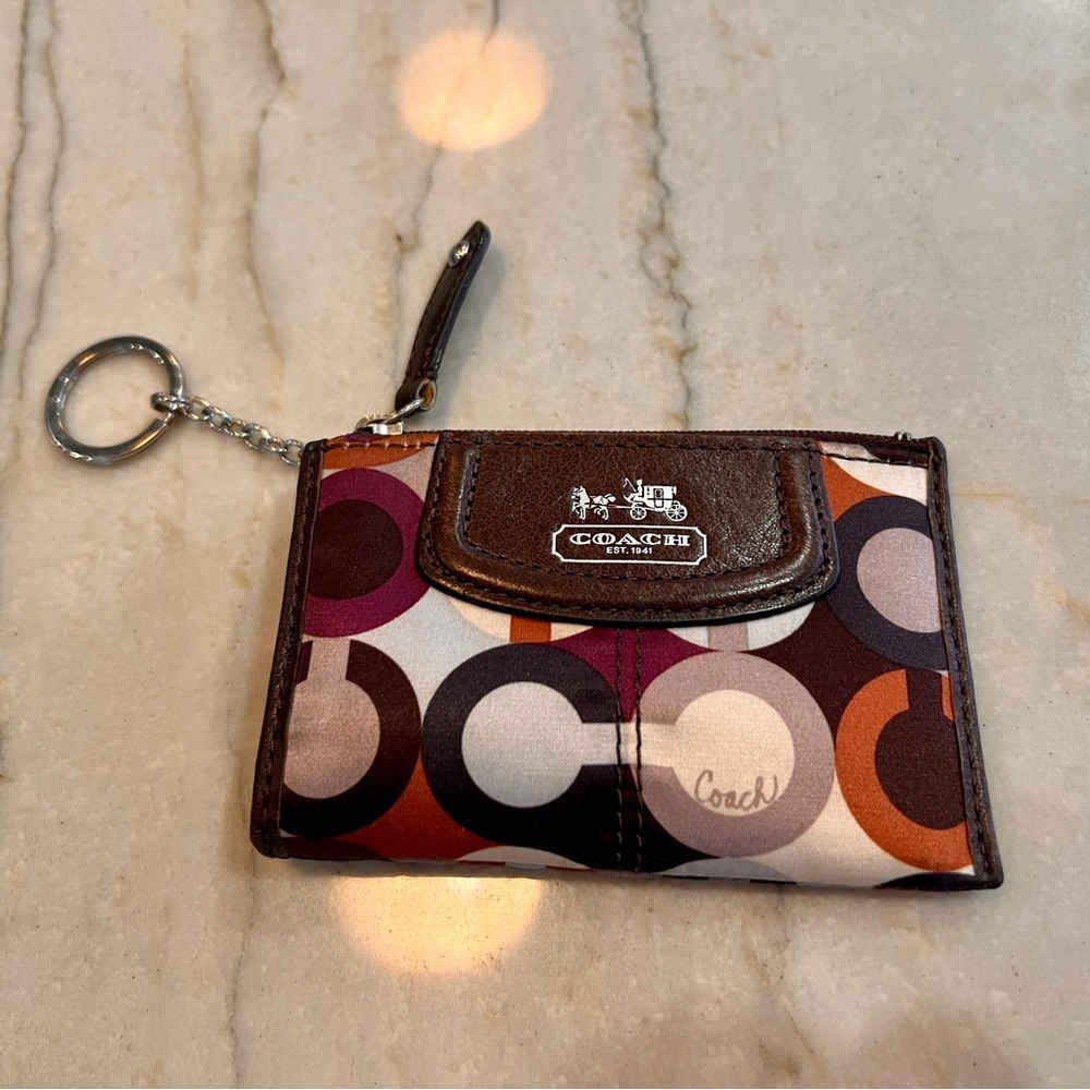 Coach Madison Maggie Keychain Coin Purse in great condition. Rare purple/orange